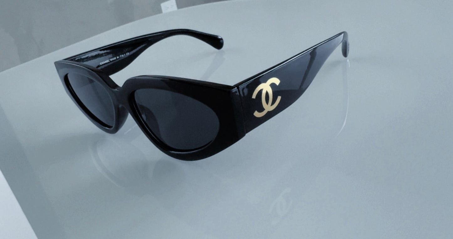 C BLACK AND GOLD SUNGLASSES