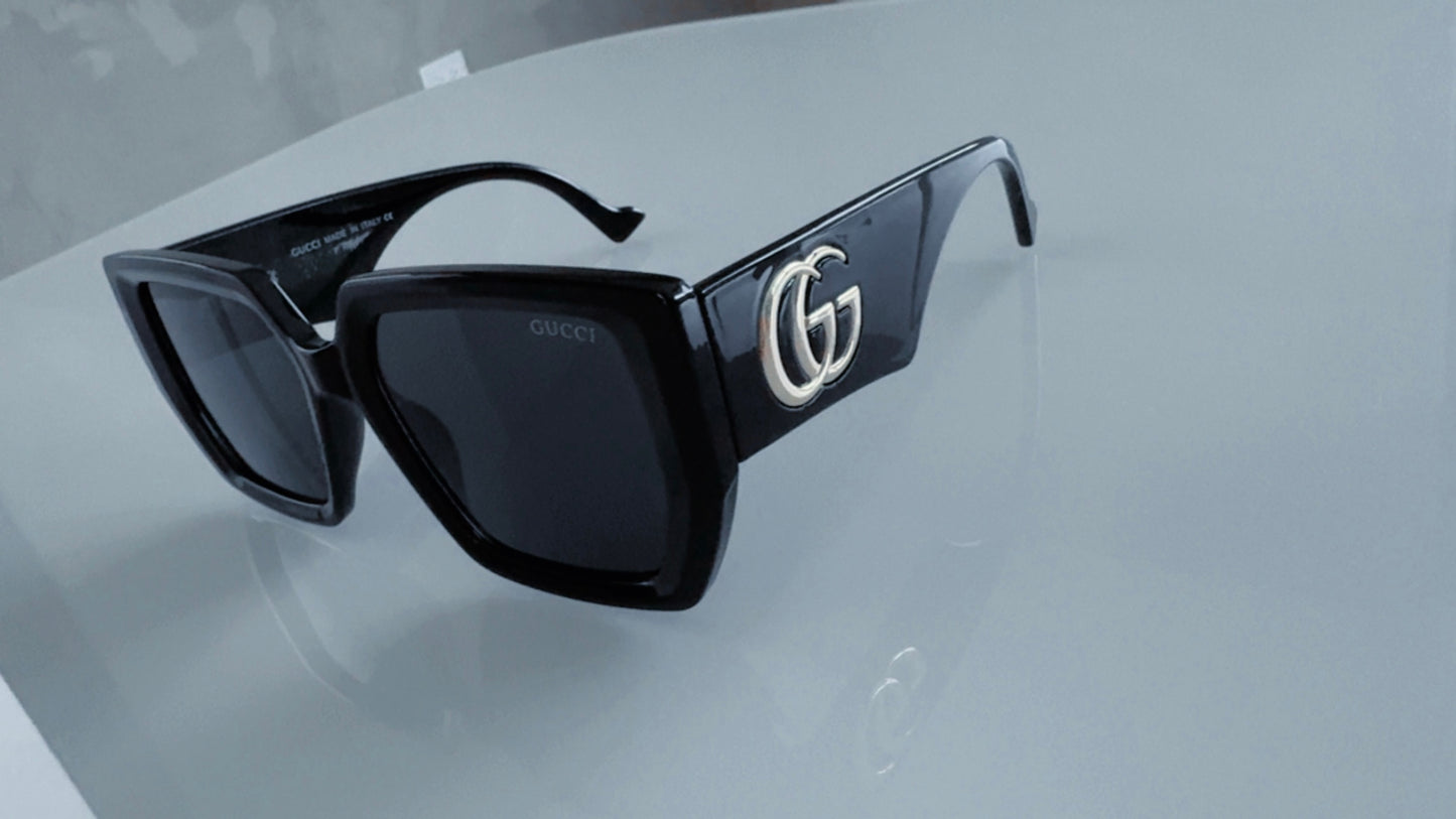 G BLACK AND GOLD SUNGLASSES