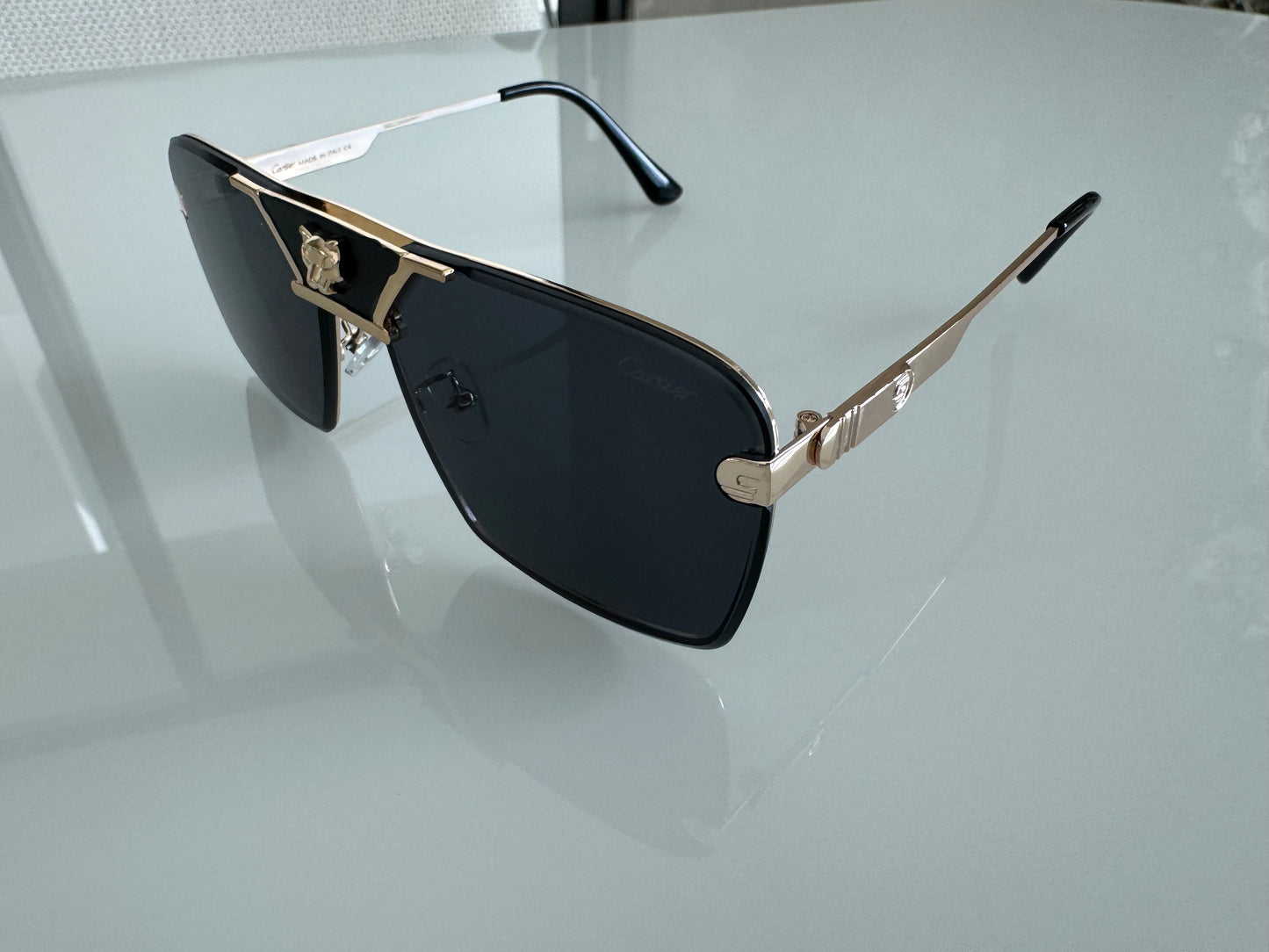 C BLACK AND GOLD SUNGLASSES