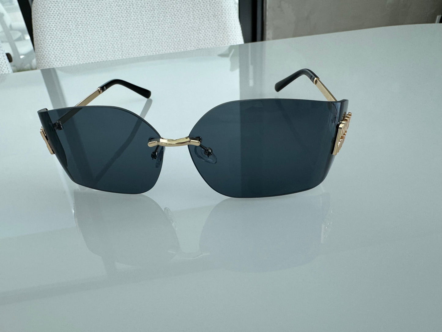 M BLACK AND GOLD SUNGLASSES