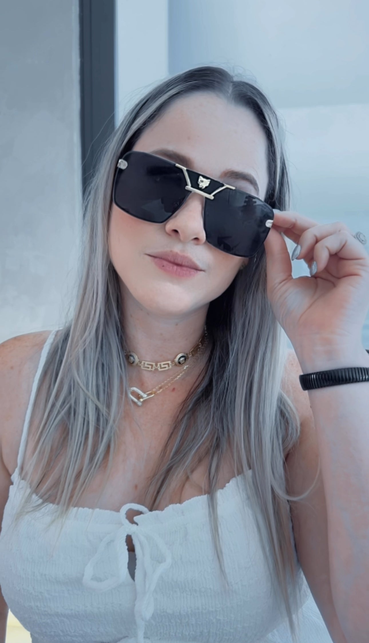 C BLACK AND GOLD SUNGLASSES